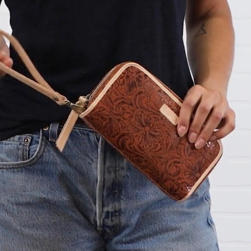 The Consuela Sally Wristlet Wallet. NEW Never used. Brown Embossed Leather